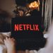 Why is Netflix considering going all-cash for WBD assets?