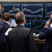Dow hits record high as investors rotate out of AI chip stocks