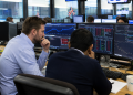 UK stocks edge higher as mining and financial shares lift FTSE 100