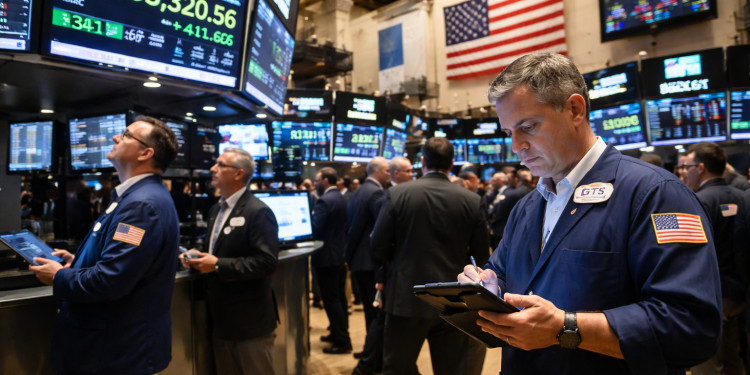 Dow jumps over 540 points as earnings, lower oil offset chip selloff