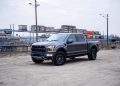 Why is Ford stock surging despite a $1.3 billion loss?