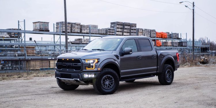 Why is Ford stock surging despite a $1.3 billion loss?