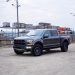 Why is Ford stock surging despite a $1.3 billion loss?