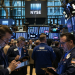 Dow edges higher as Intel slips despite earnings, Nasdaq dips