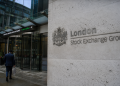 London stocks edge lower as geopolitical concerns offset gains in midcaps