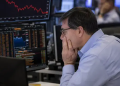 Dow slips as Hormuz uncertainty, Intel share sale weigh on Wall Street