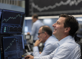 Dow, S&P 500 hit record highs as AI earnings and oil drop lift stocks
