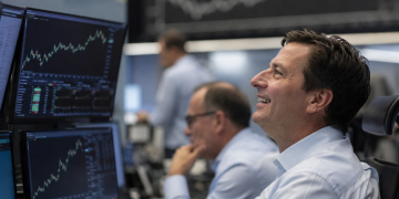 Dow, S&P 500 hit record highs as AI earnings and oil drop lift stocks