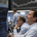 Dow, S&P 500 hit record highs as AI earnings and oil drop lift stocks