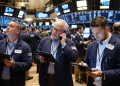 Dow slips as Nasdaq jumps after weak jobs data cools Fed rate hike bets
